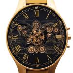 ساعة حائط بتصميم ساعة يد بتروس ذهبية - 6